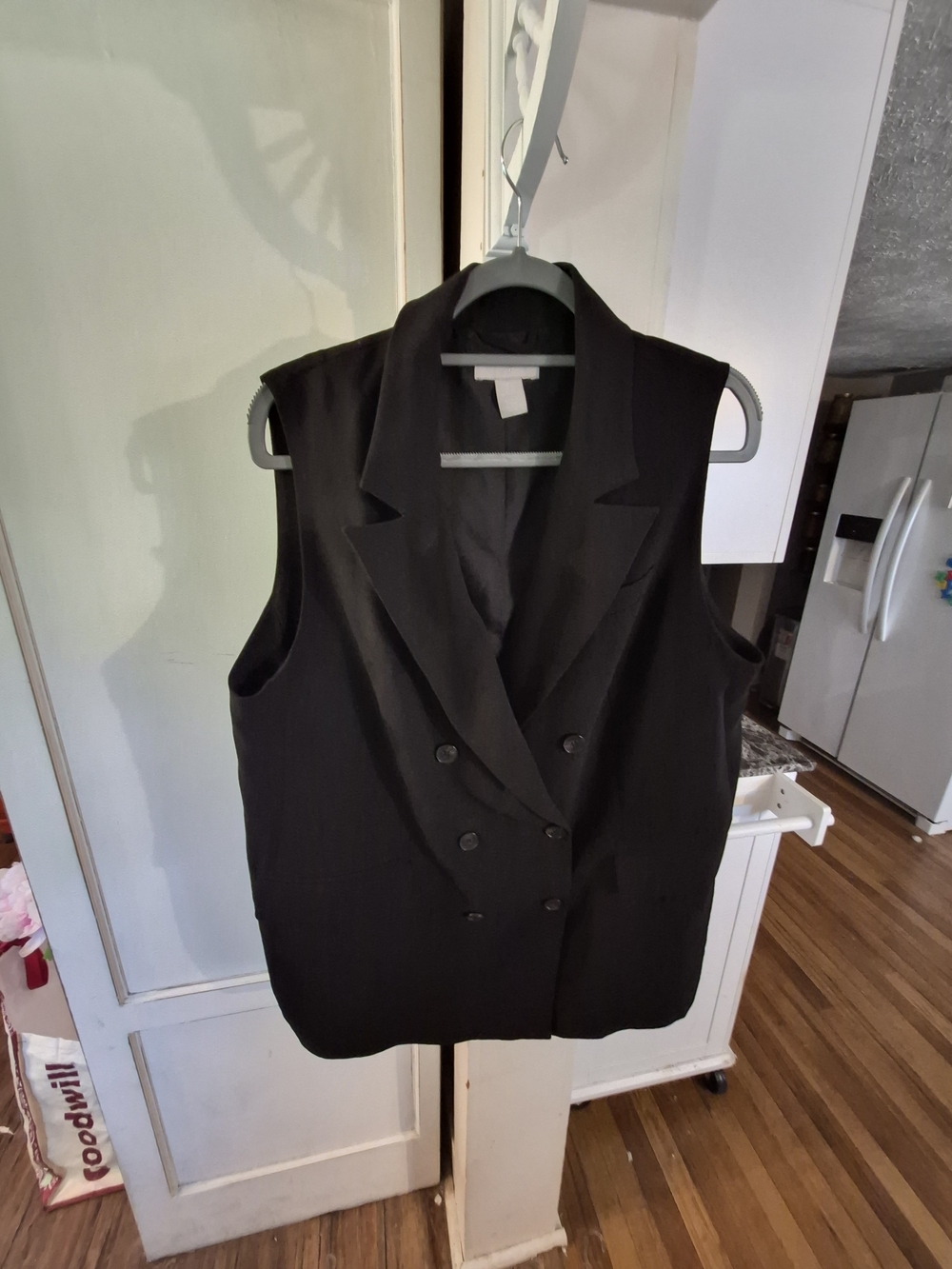 H&M black linen-blend vest features a double-breasted button closure and notched